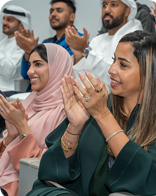 DFF team members applauding at an event